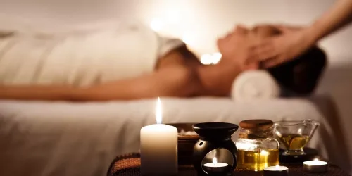 Aroma,Spa.,Girl,Enjoying,Massage,In,Luxury,Spa,With,Candles